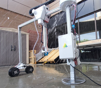 The robot being sprayed with water for our IP55 test